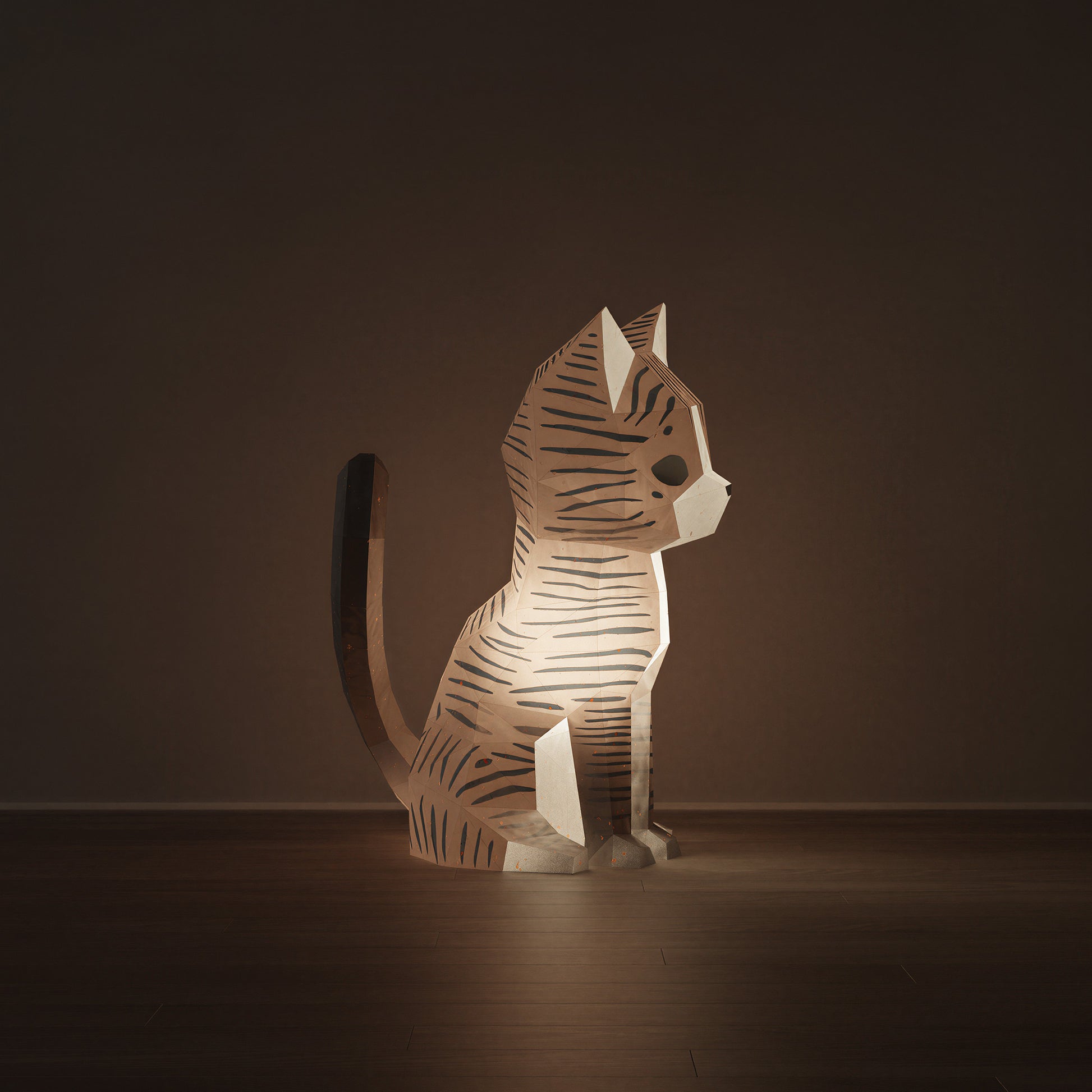 Sculpture en papier Neko le chat allumée en veilleuse, diffusant une lumière douce et chaleureuse. Kit origami 3D aux teintes sable et blanc au design épuré, luminaire artisanal à assembler avec colle. Notre chat regarde sur le côté droit