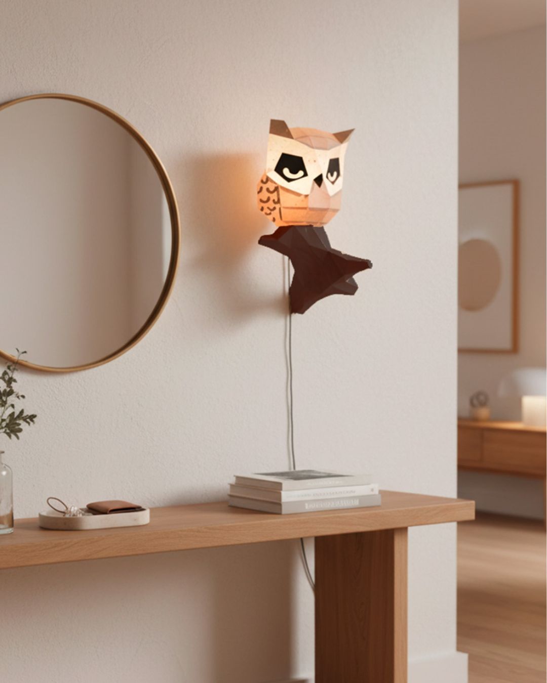 Décoration murale hibou en papier 3D Moki Moki, utilisée comme lampe sur un mur blanc dans une entrée au style épuré et naturel.