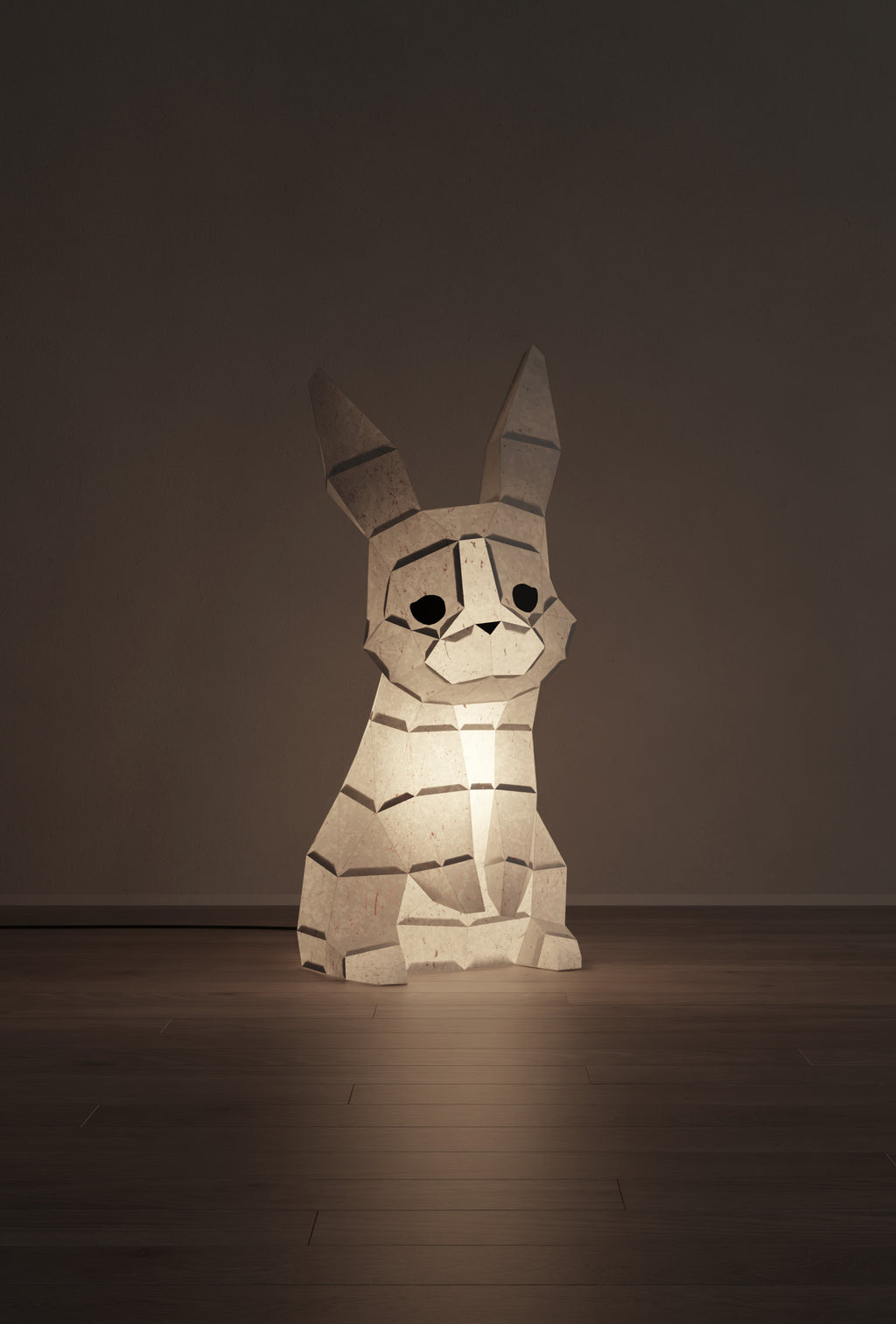 veilleuse bébé et enfant lapin en papier style origami 3D - la veilleuse est allumée.