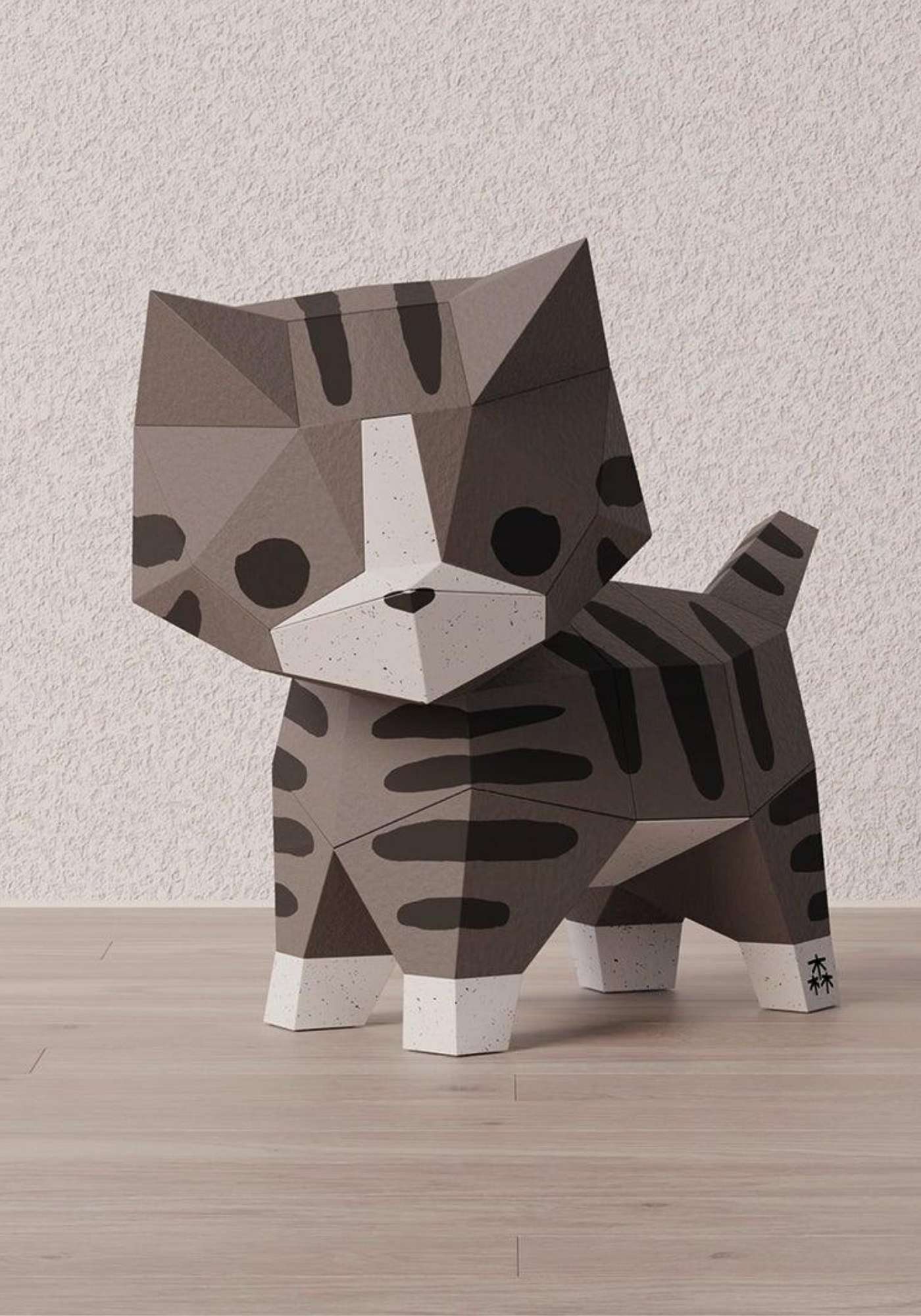 Origami 3D d'un petit chat. On voit le chaton réalisé en papier en gros plan.