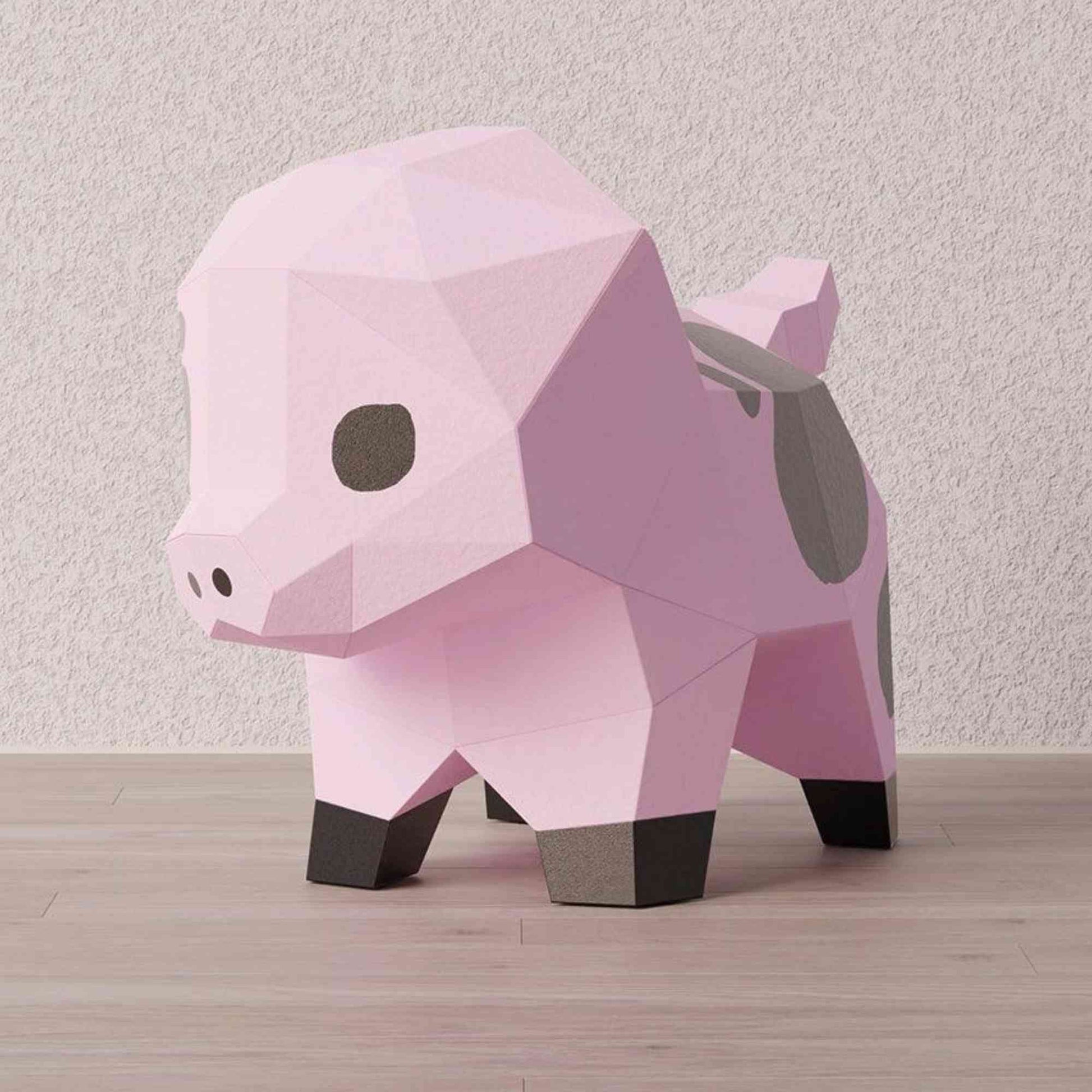 Origami 3D complet d'un petit cochon. L'animal de la ferme en papercraft est en papier créatif coloré et imprimé de ses couleurs naturelles. Il est de côté